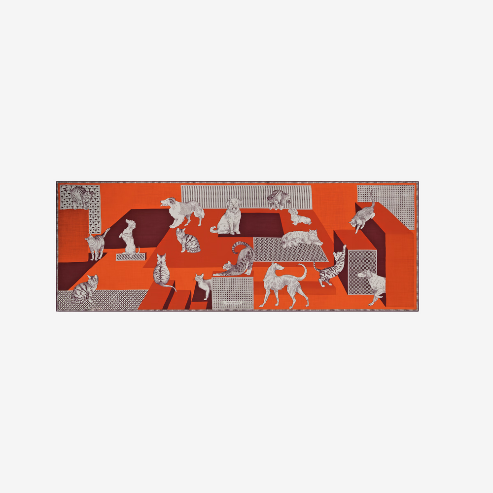 image of a red and orange scarf with animals on it