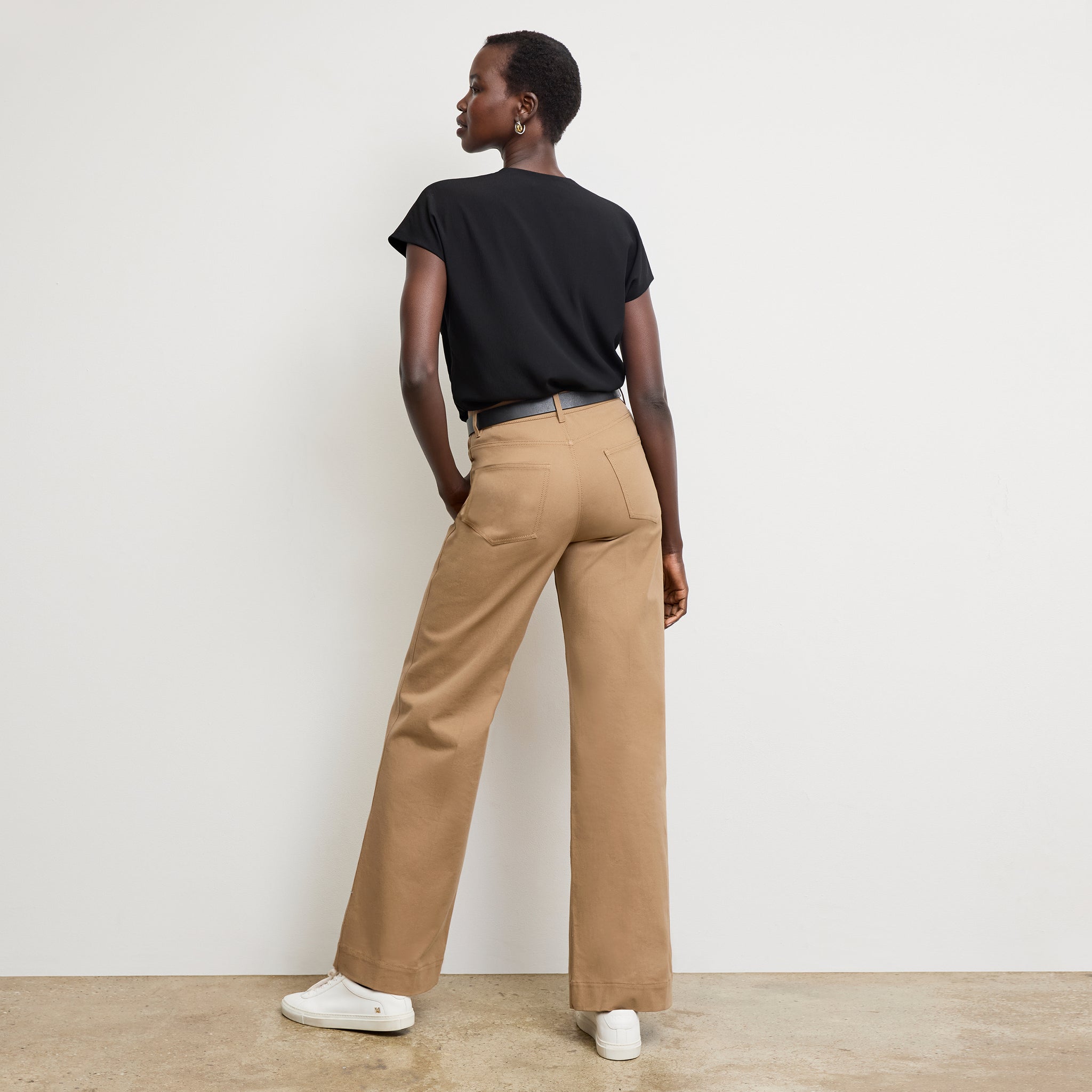 back image of a woman wearing the sabine top in ivory