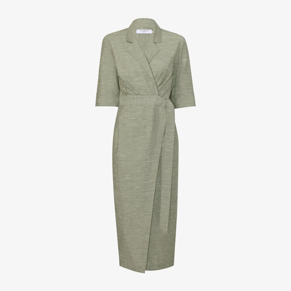 Green dress with a belt on a white background