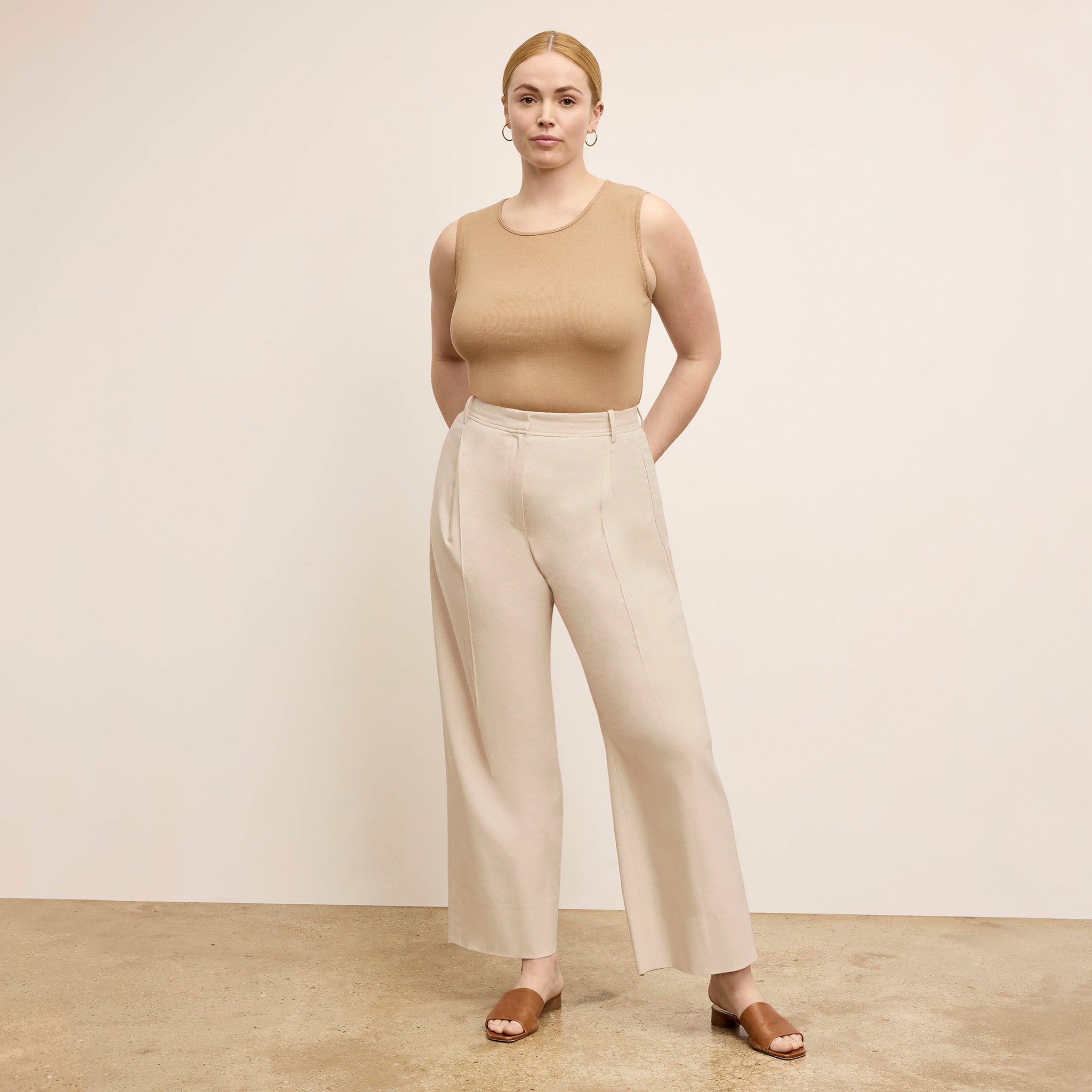 front image of a woman wearing the arlo pant in natural 