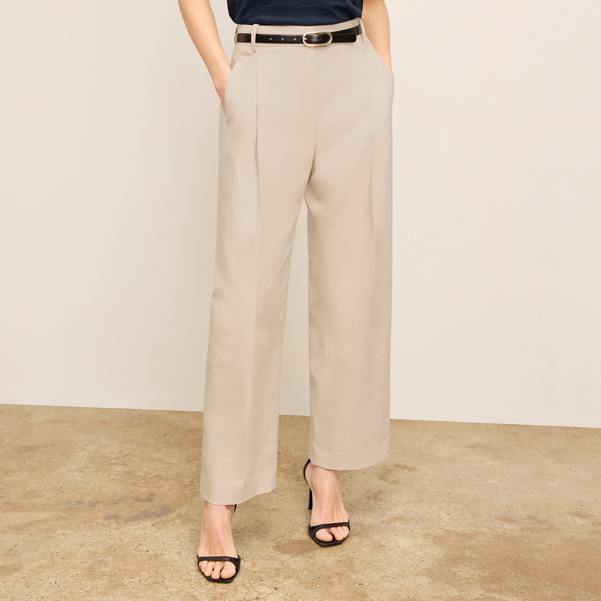 front image of a woman wearing the arlo pant in natural 