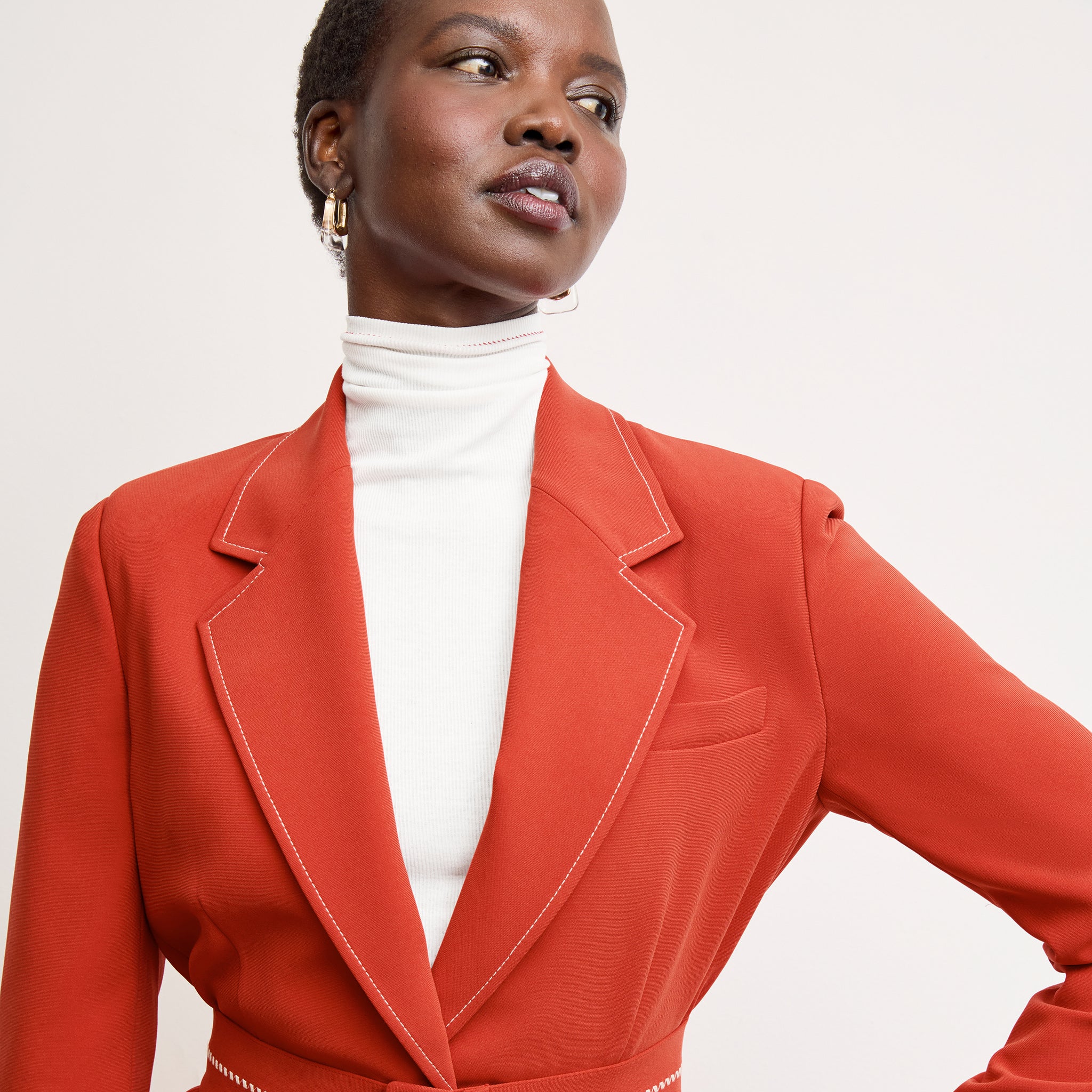 front image of a woman wearing the axam top in white