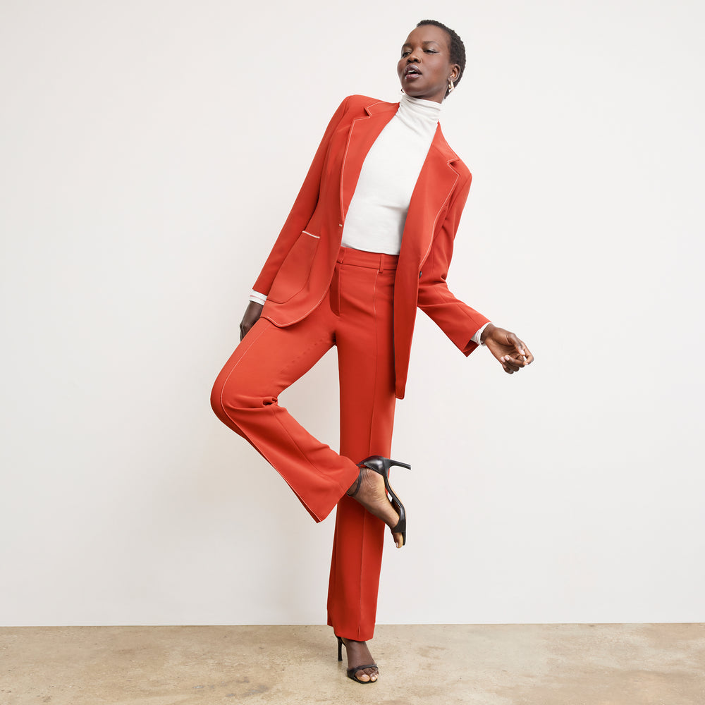 front image of a woman wearing the lowen pant in ginger with topstitch