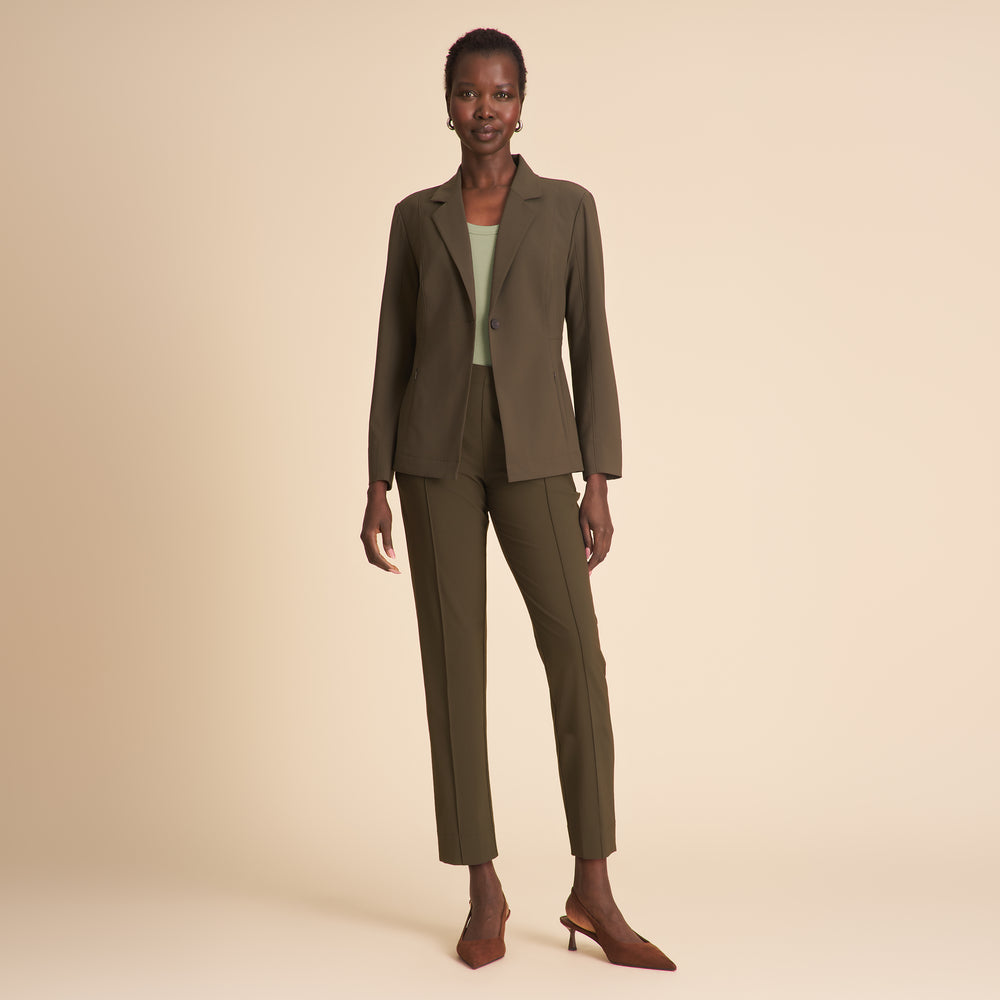 Front image of a woman wearing the Moreland jacket in olive