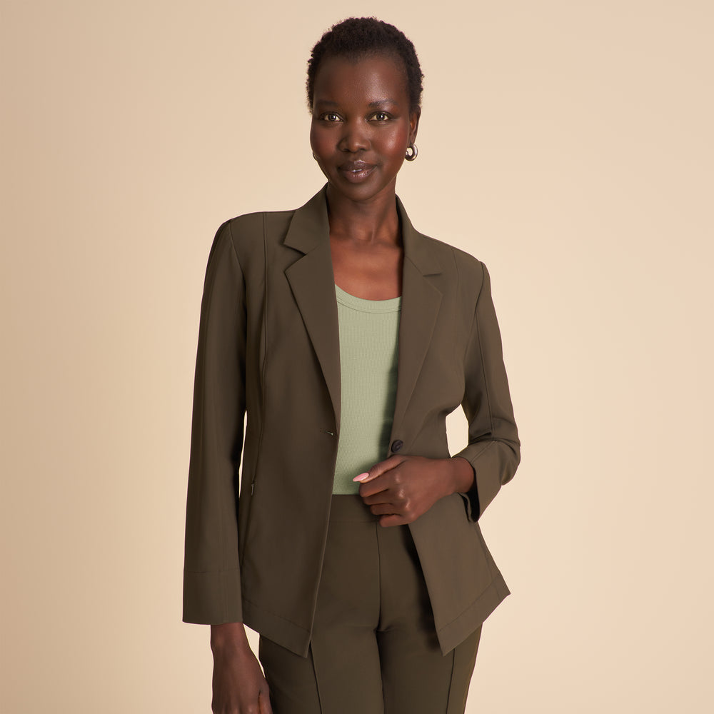 Front image of a woman wearing the Moreland jacket in olive