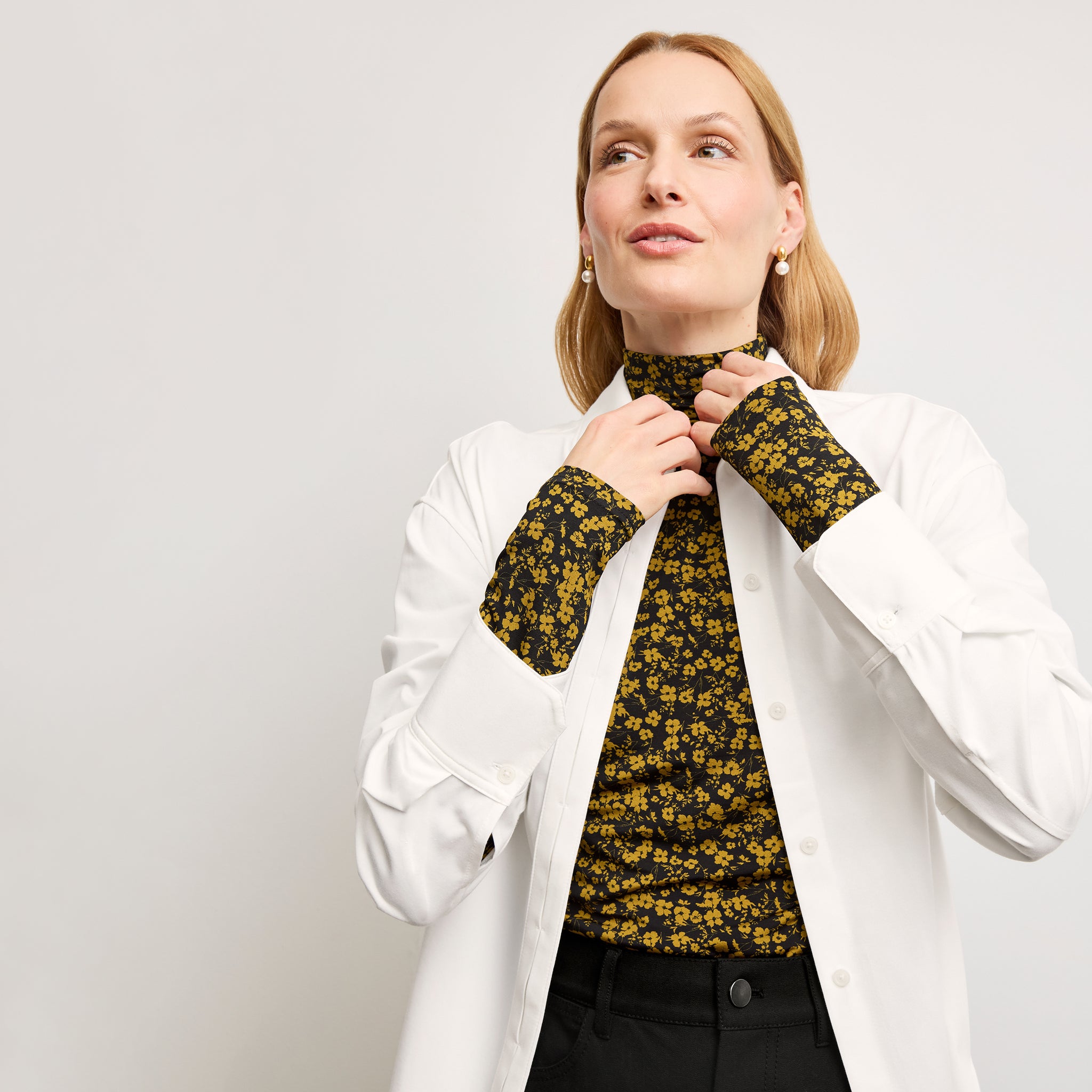 front image of a woman wearing the axam top in bloom print 