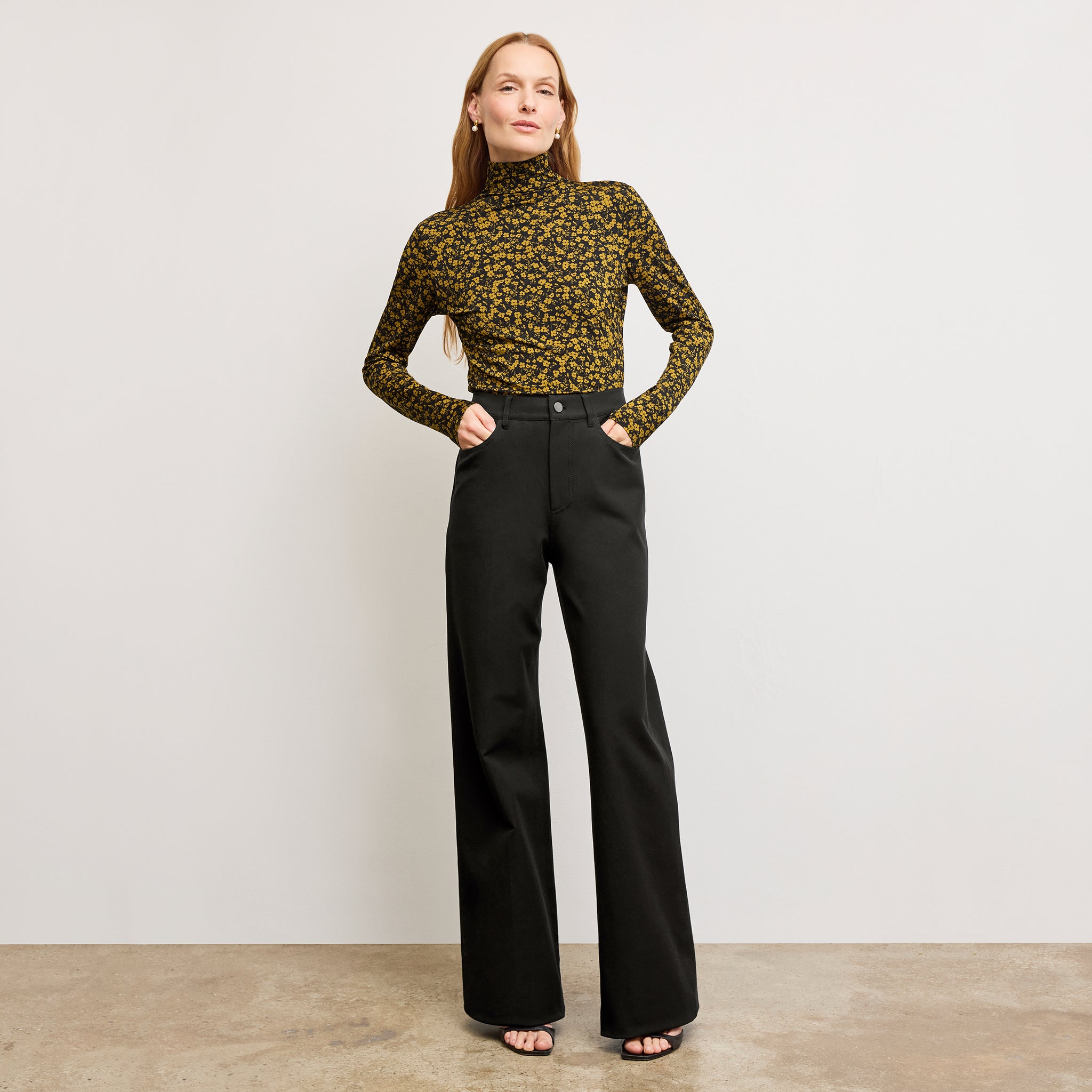 front image of a woman wearing the axam top in bloom print 