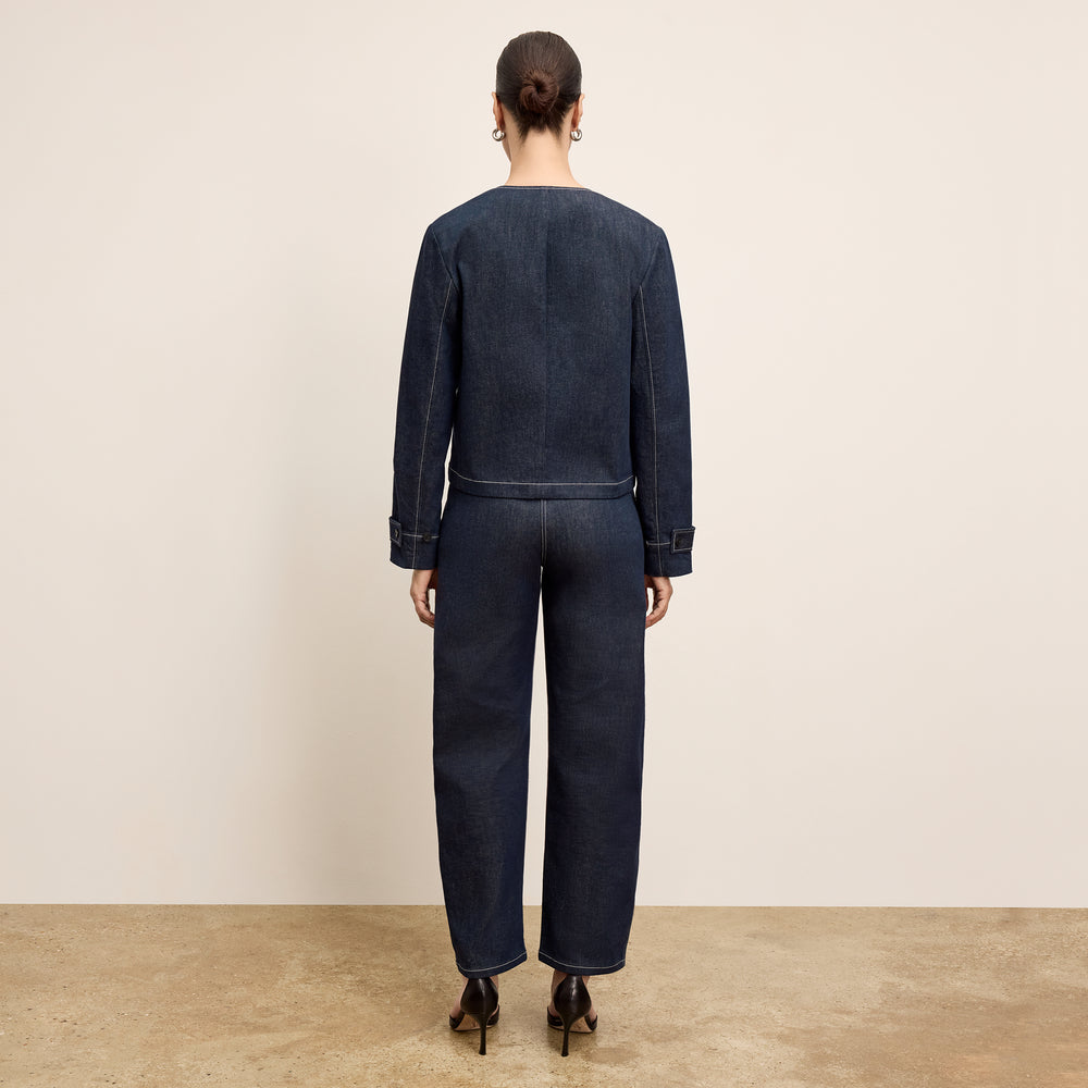 back image of a woman wearing the ayla jacket in midnight wash