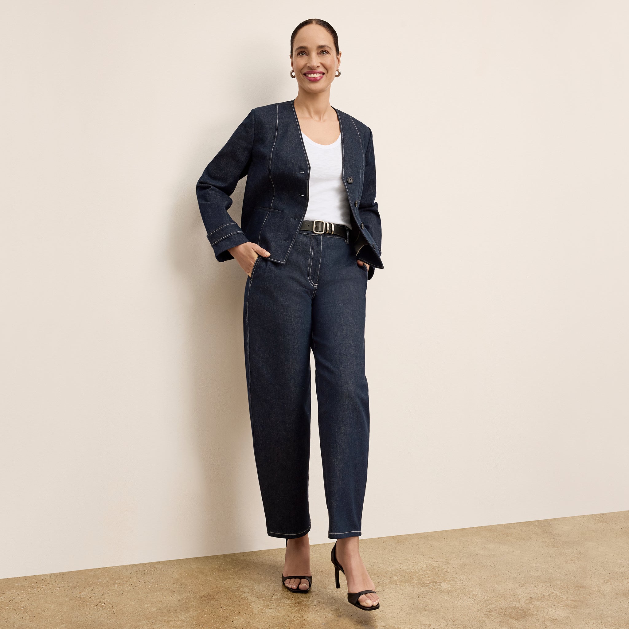 front image of a woman wearing the bari jean in midnight wash