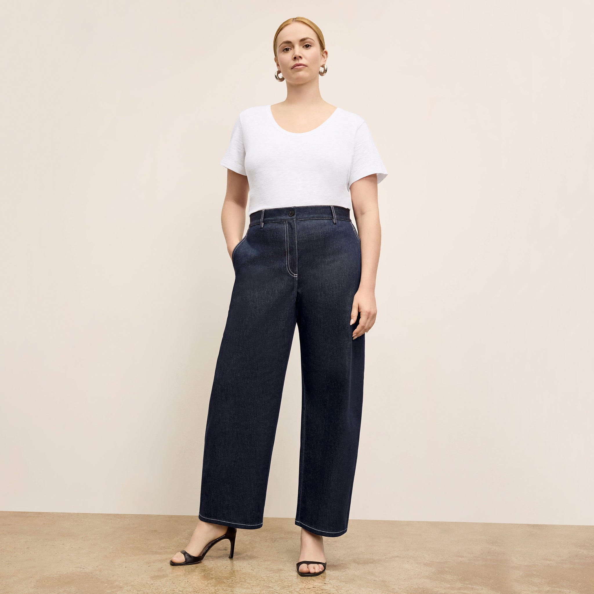 front image of a woman wearing the bari jean in midnight wash