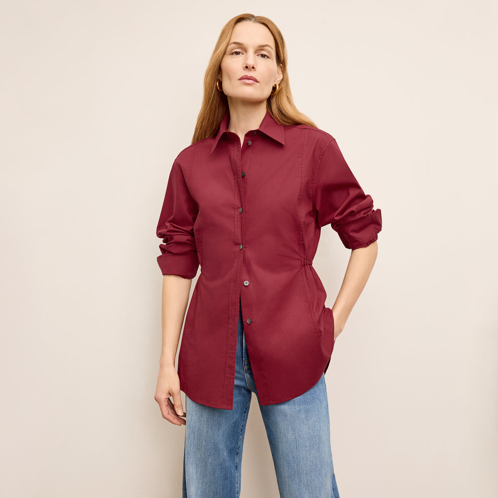 front image of a woman wearing the bentley shirt in cinnabar