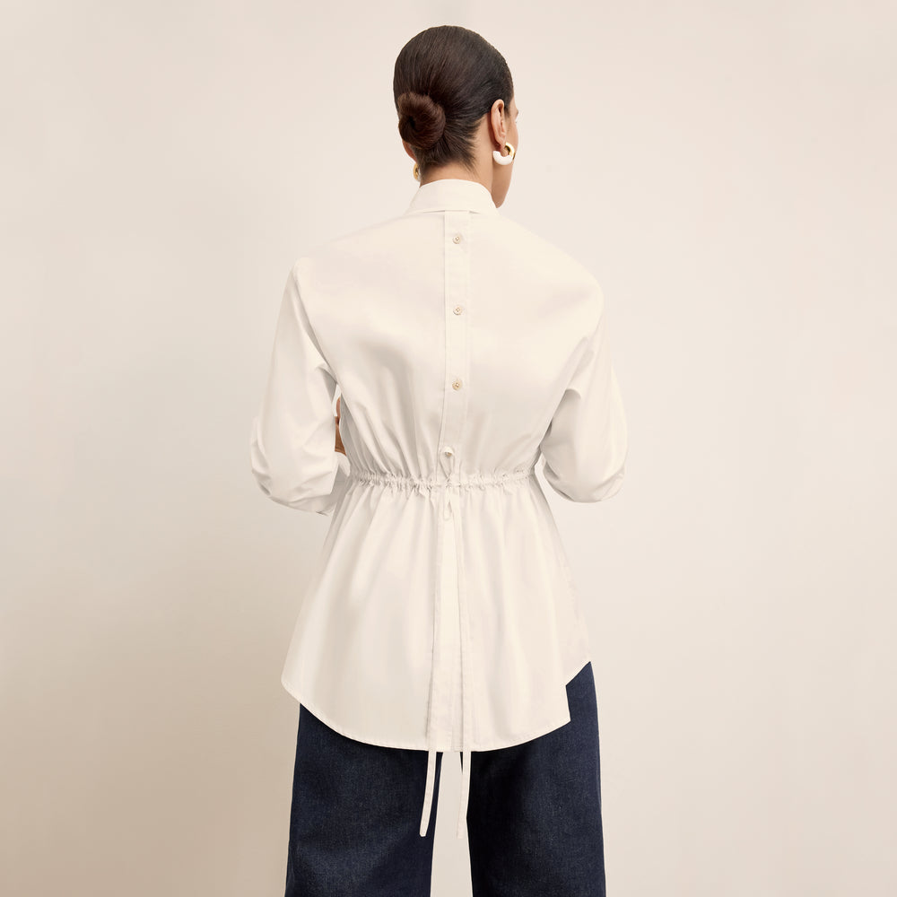back image of a woman wearing the bentley shirt in eggshell