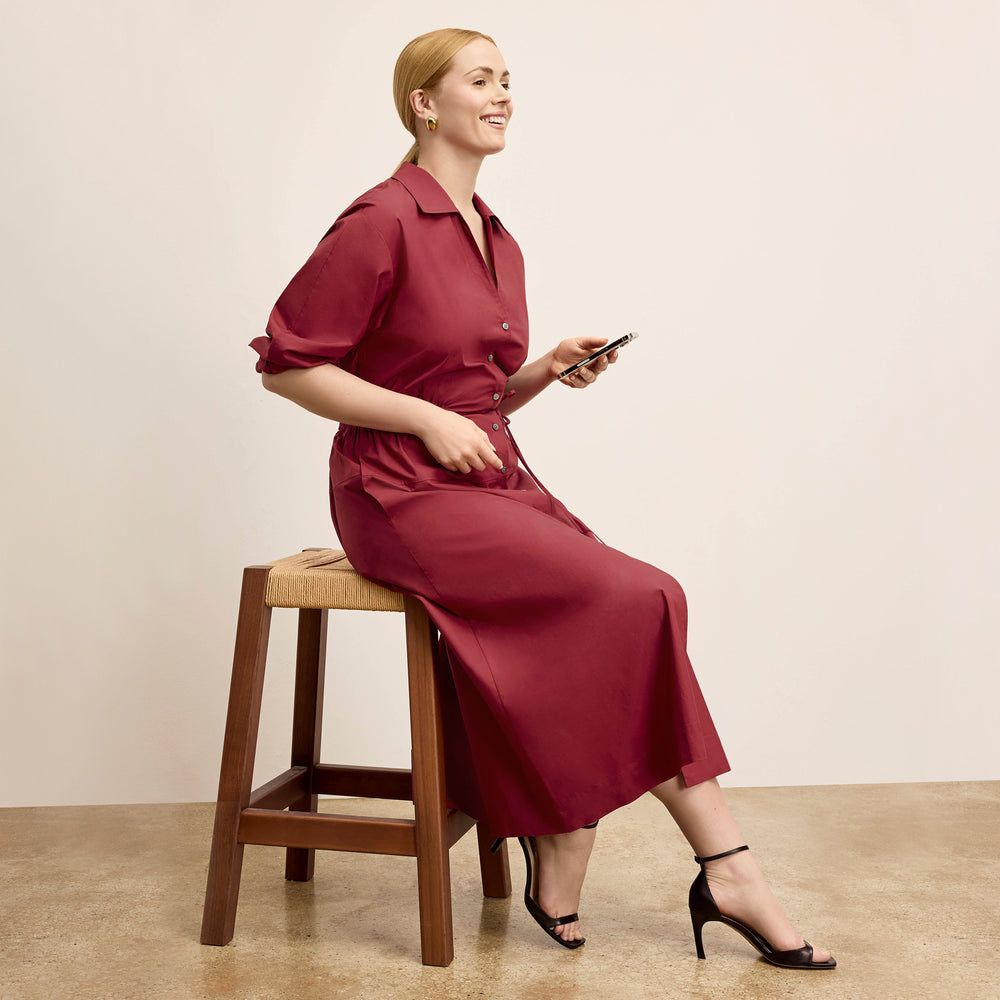 front image of a woman wearing the boden dress in cinnabar