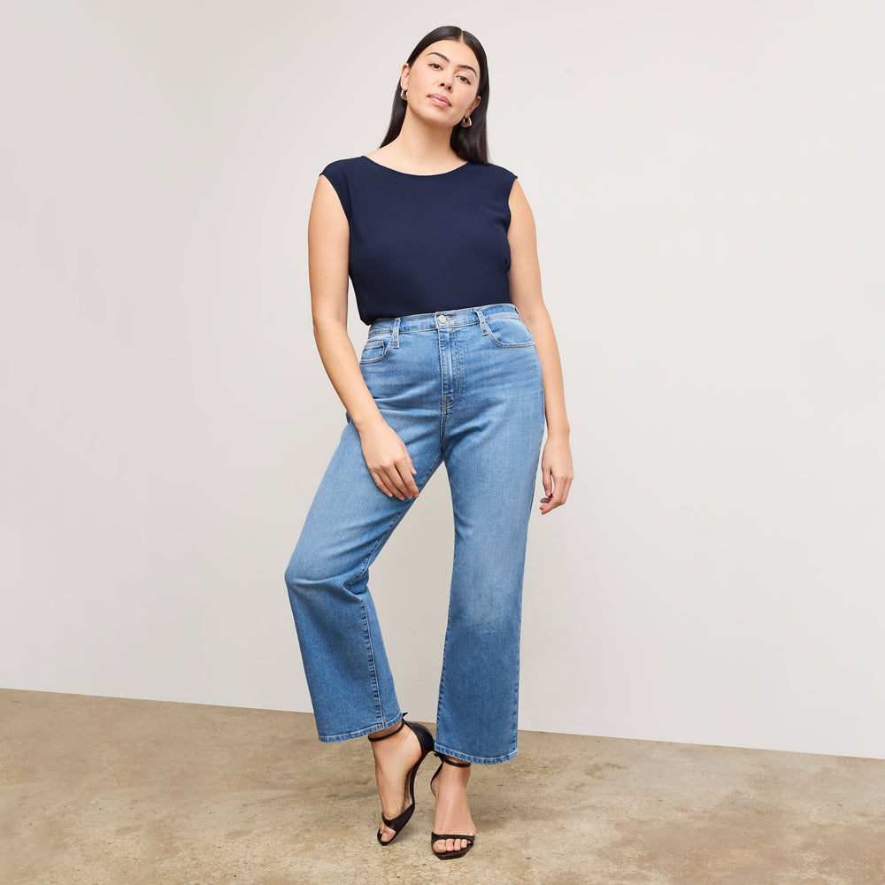 front image of a woman wearing the brooke top in soft navy