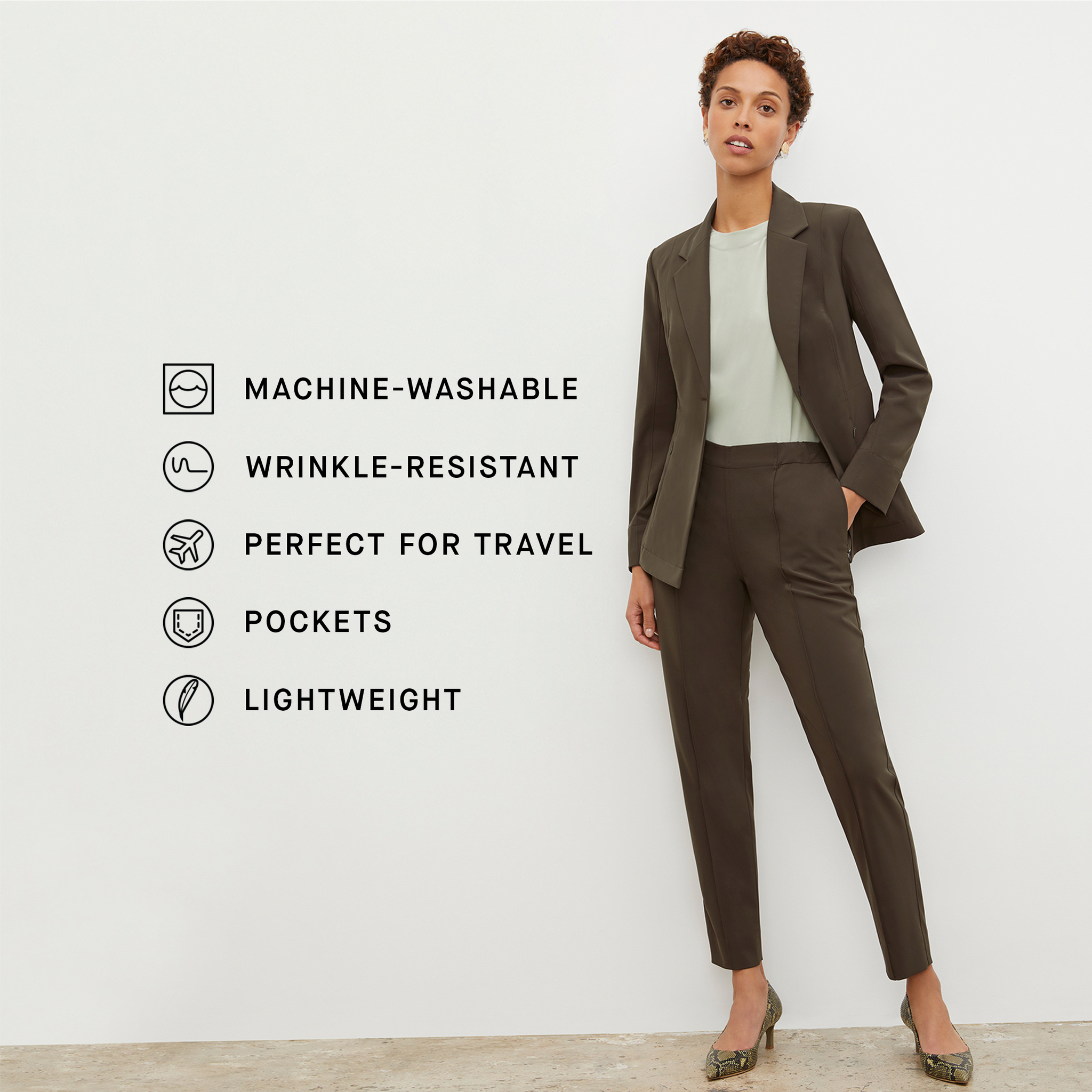 Front image of a woman standing wearing the colby pant in olive