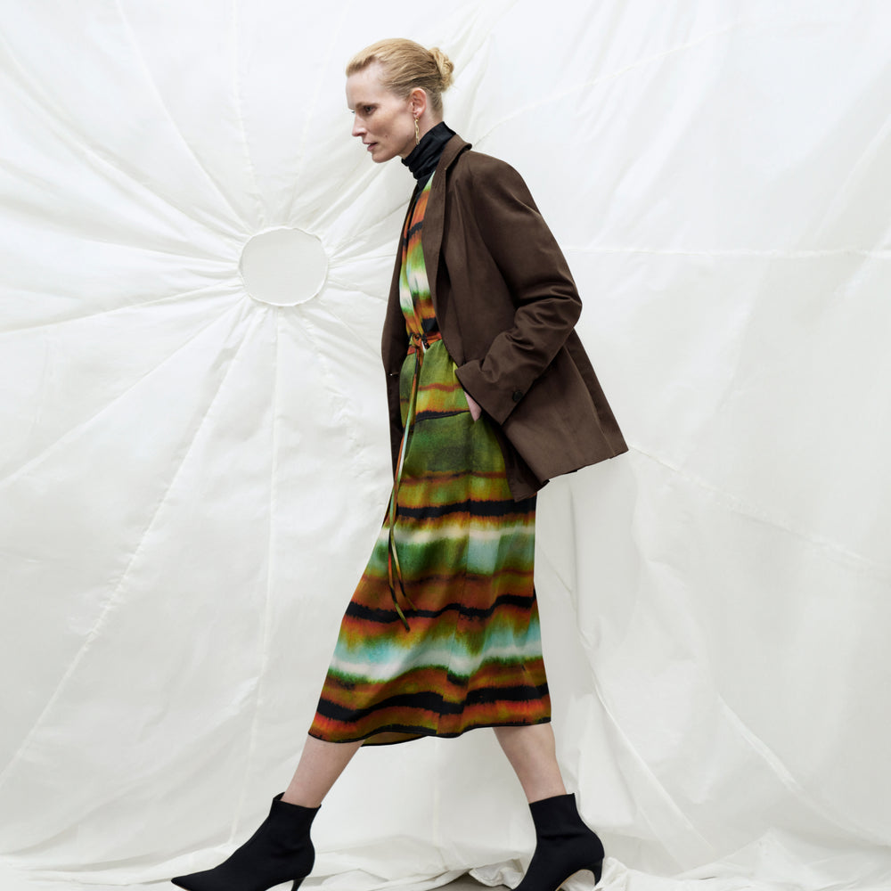 Front image of a woman wearing the Deana dress in Faded Print