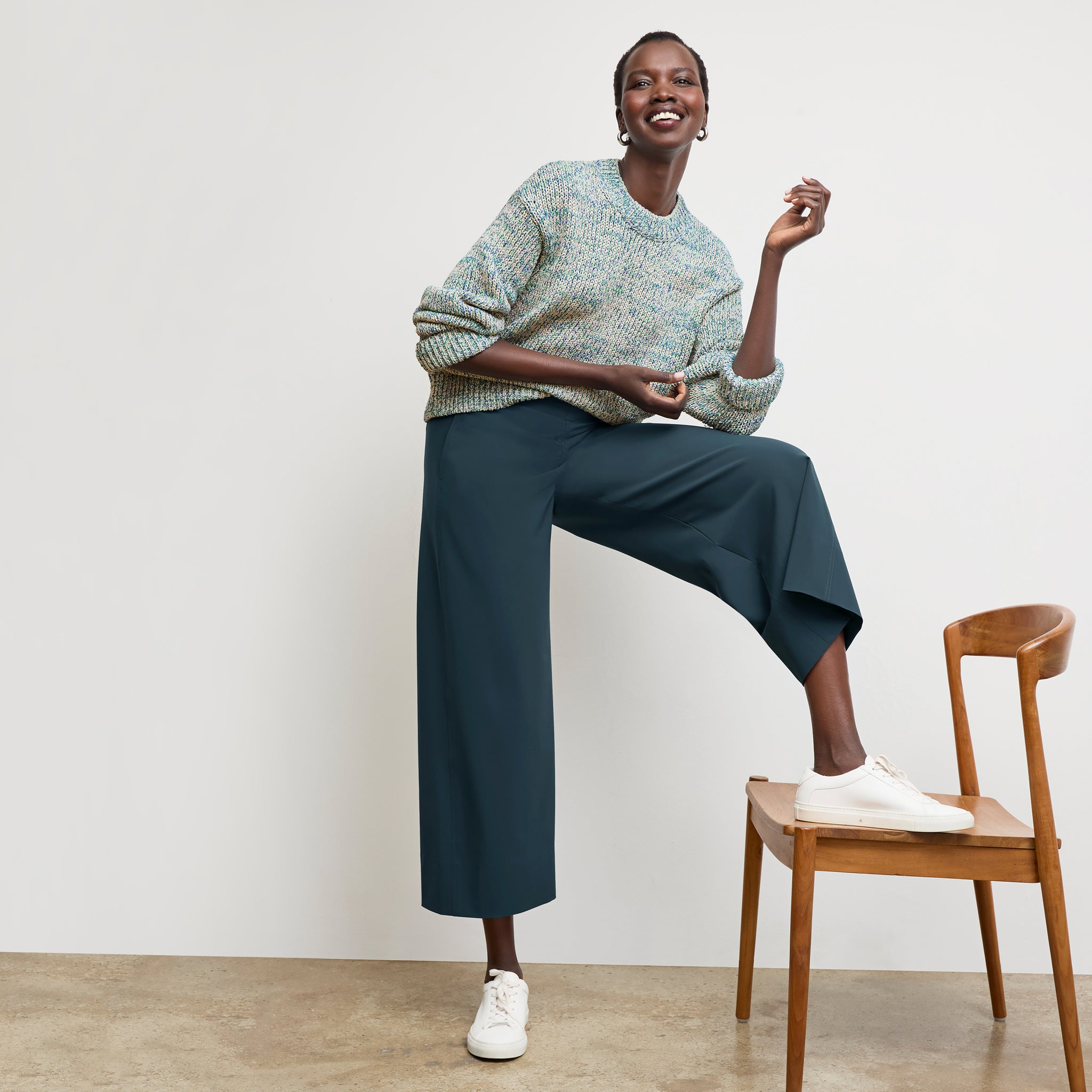 front image of a woman wearing the maura sweater in multi