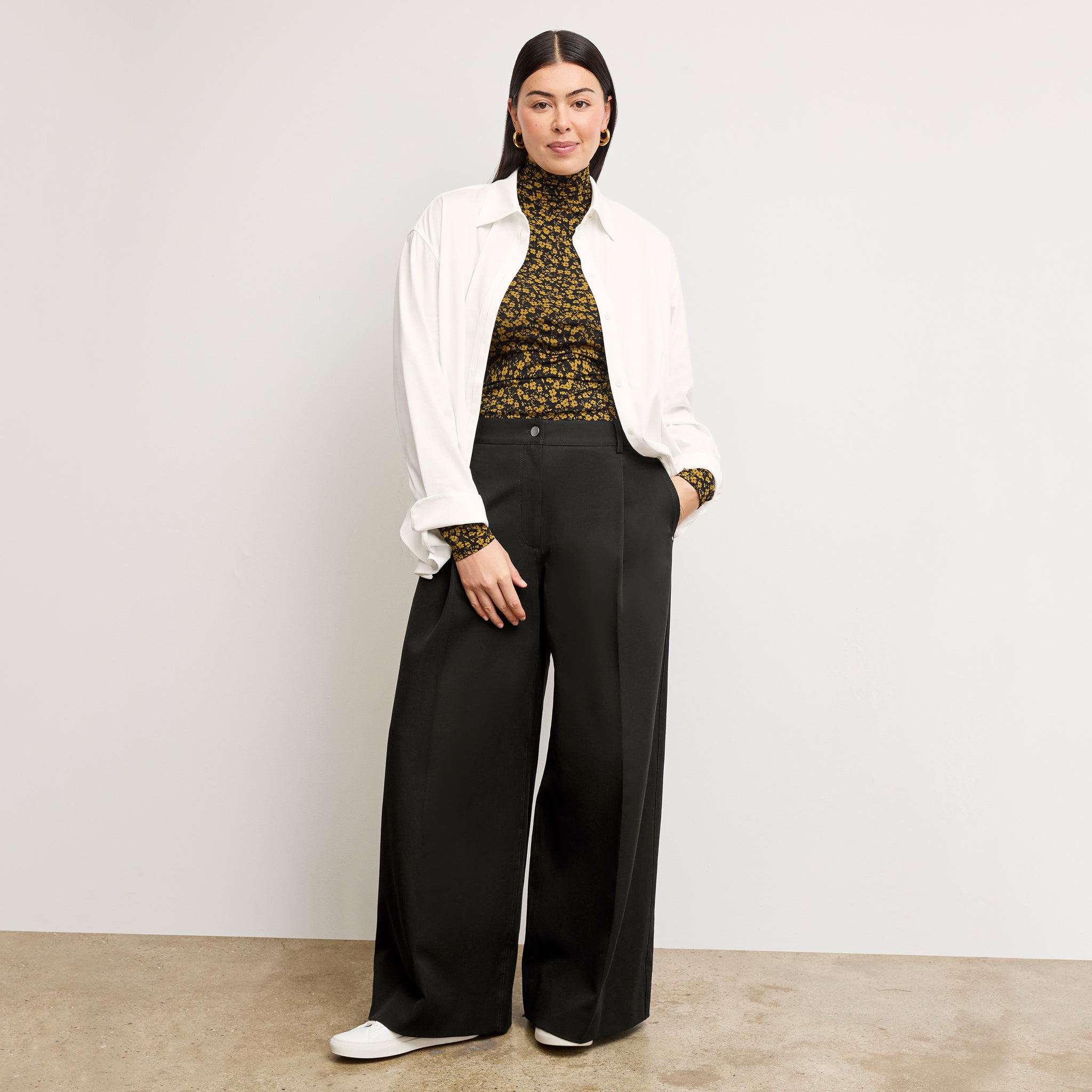 front image of a woman wearing the axam top in bloom print 