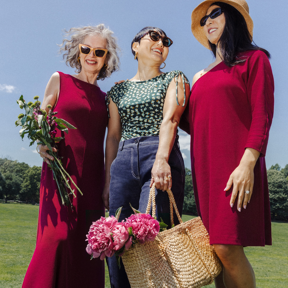 Three women standing with one of them Wearing Bari Barrel-Leg Jean - Stretch Denim :: Midnight Wash