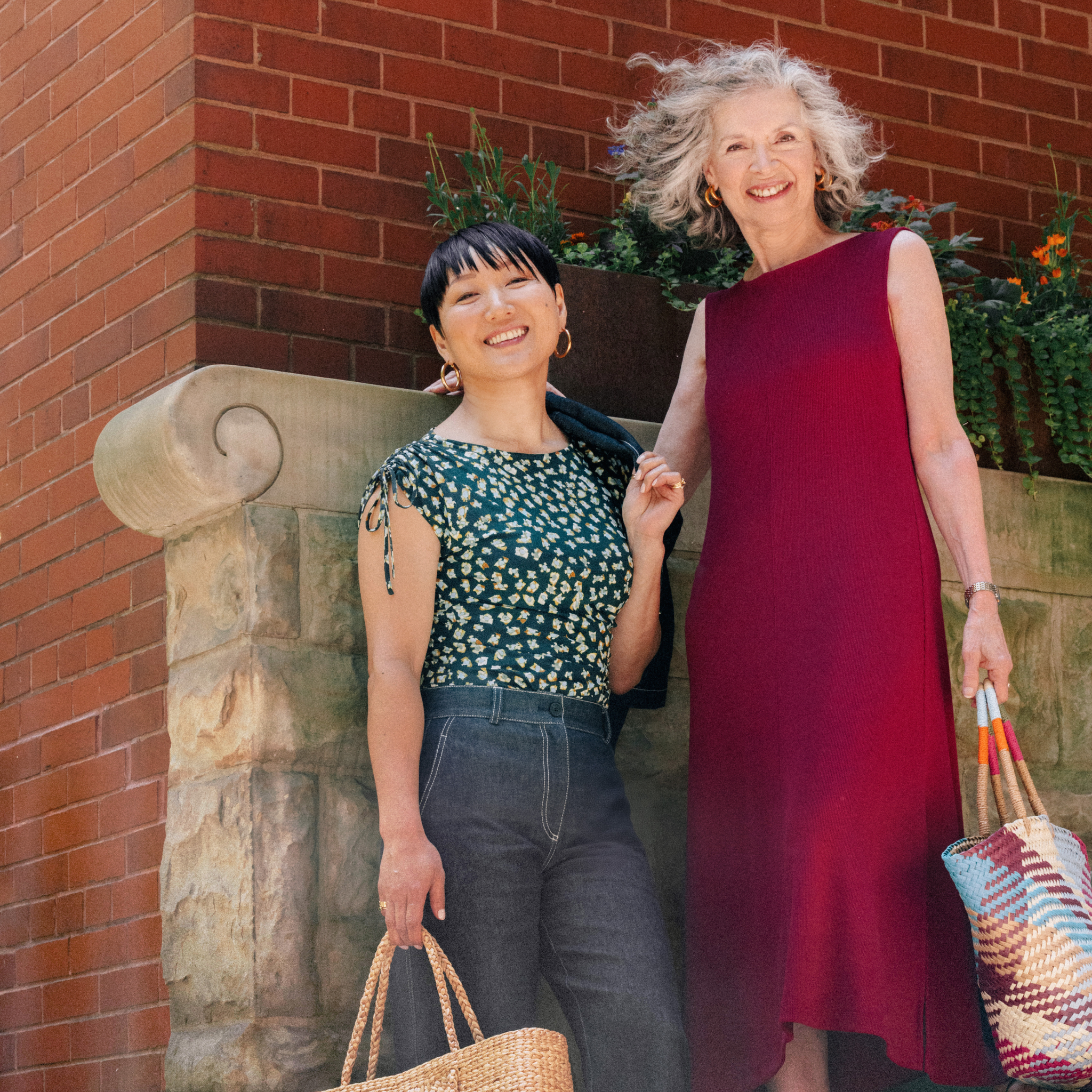 Two women standing with one of them Wearing Bari Barrel-Leg Jean - Stretch Denim :: Midnight Wash