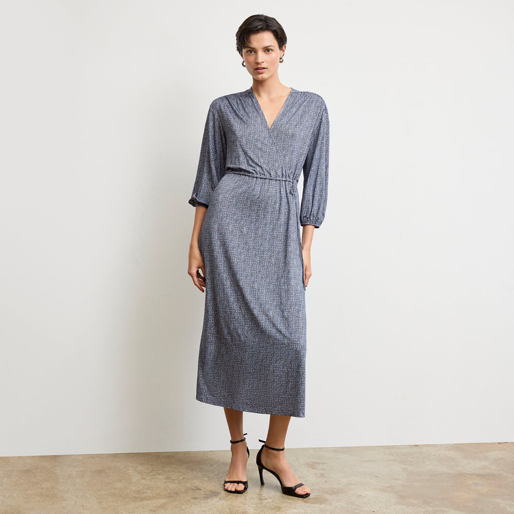 Front image of a woman wearing the hope dress in blueprint sketch