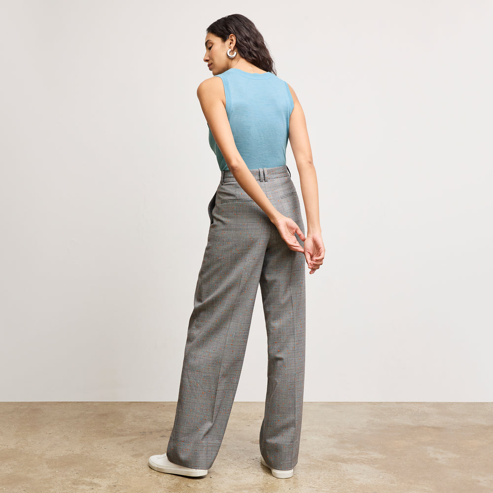 back image of a woman wearing the jamie tank in morning sky
