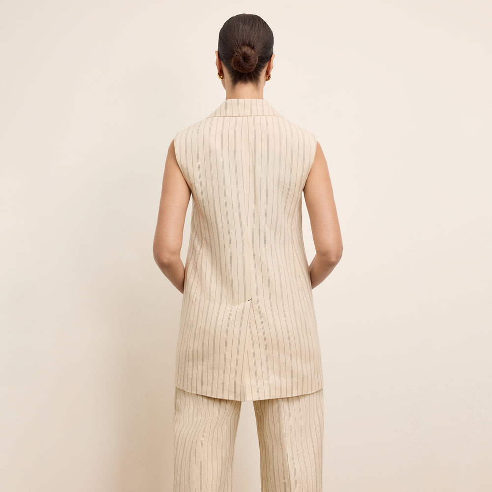 back image of a woman wearing the teddy jacket in natural