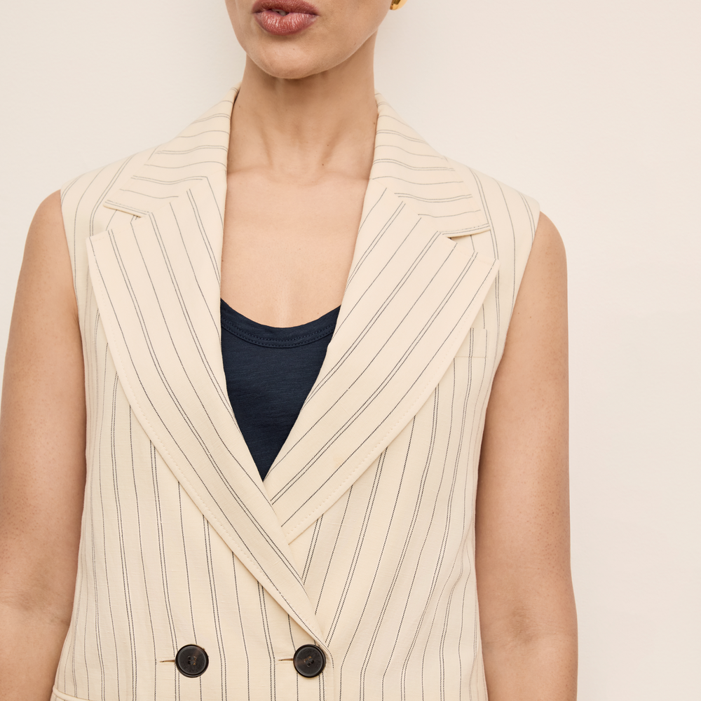 Front detail image of a woman wearing the Kasa Vest