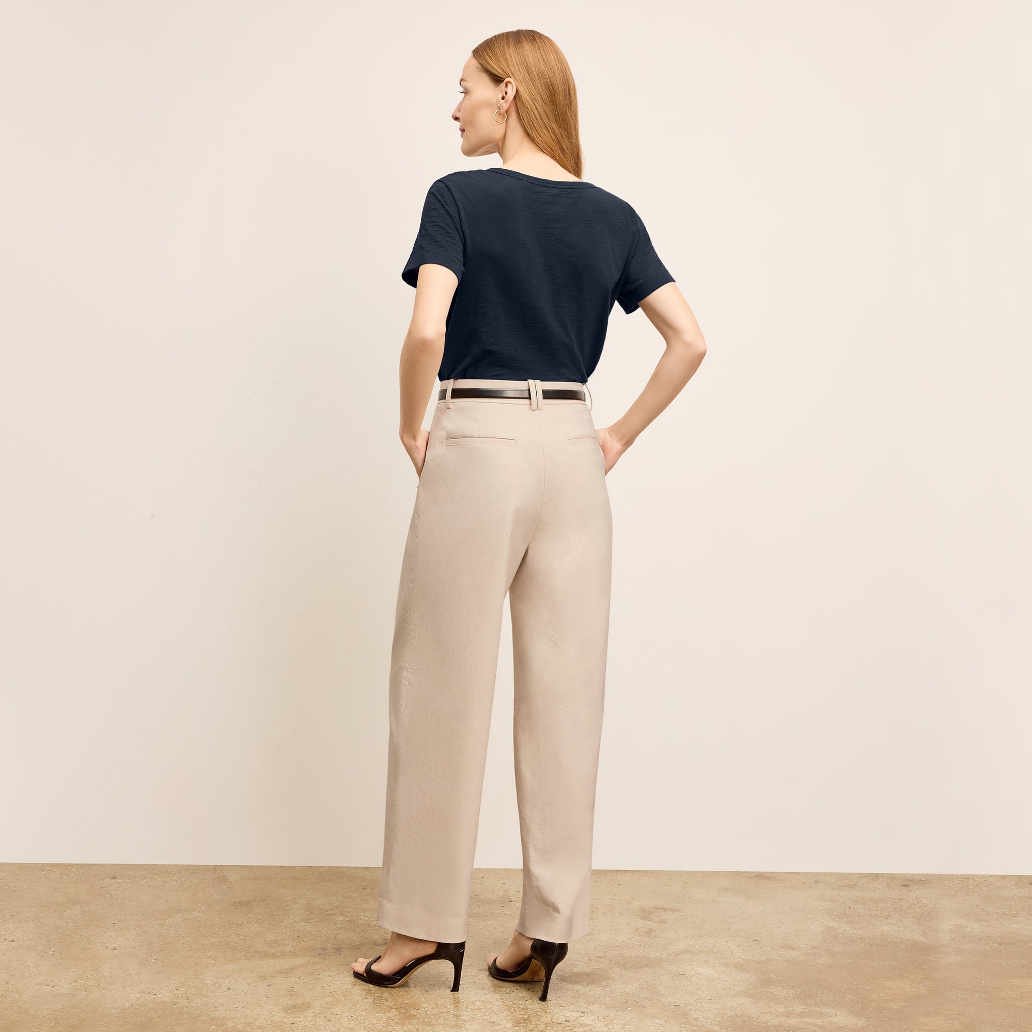 back image of a woman wearing the arlo pant in natural 