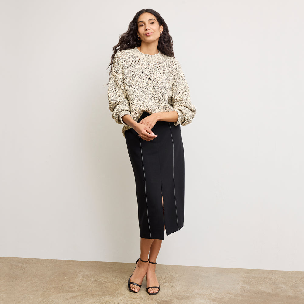 front image of a woman wearing the kiki sweater in ivory/black
