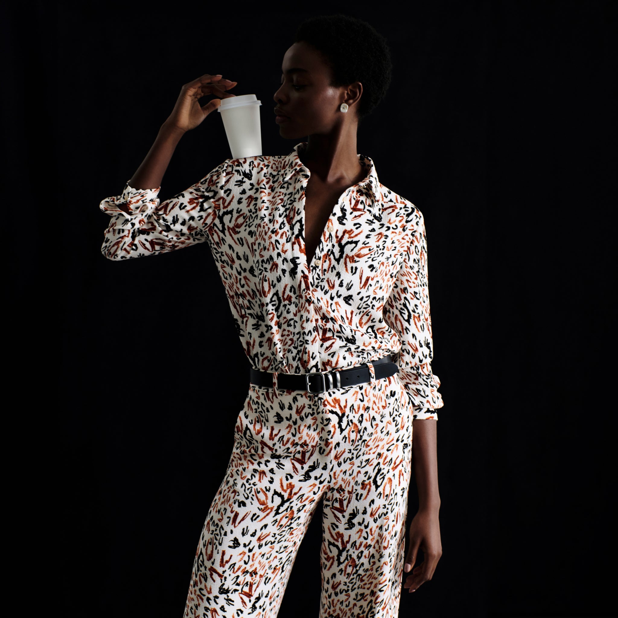 front image of a woman wearing the tinsley trousers in leopard sketch