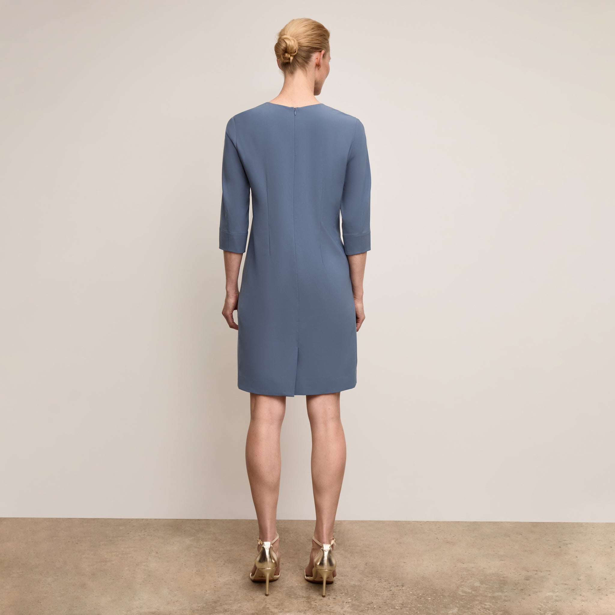 Back image of a woman wearing Lancia Dress Origamitech Dusty Blue