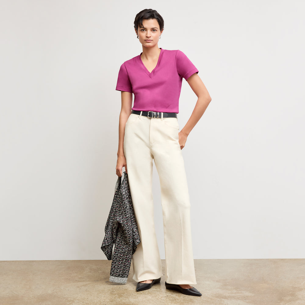 front image of a woman wearing the lee t-shirt in pink berry