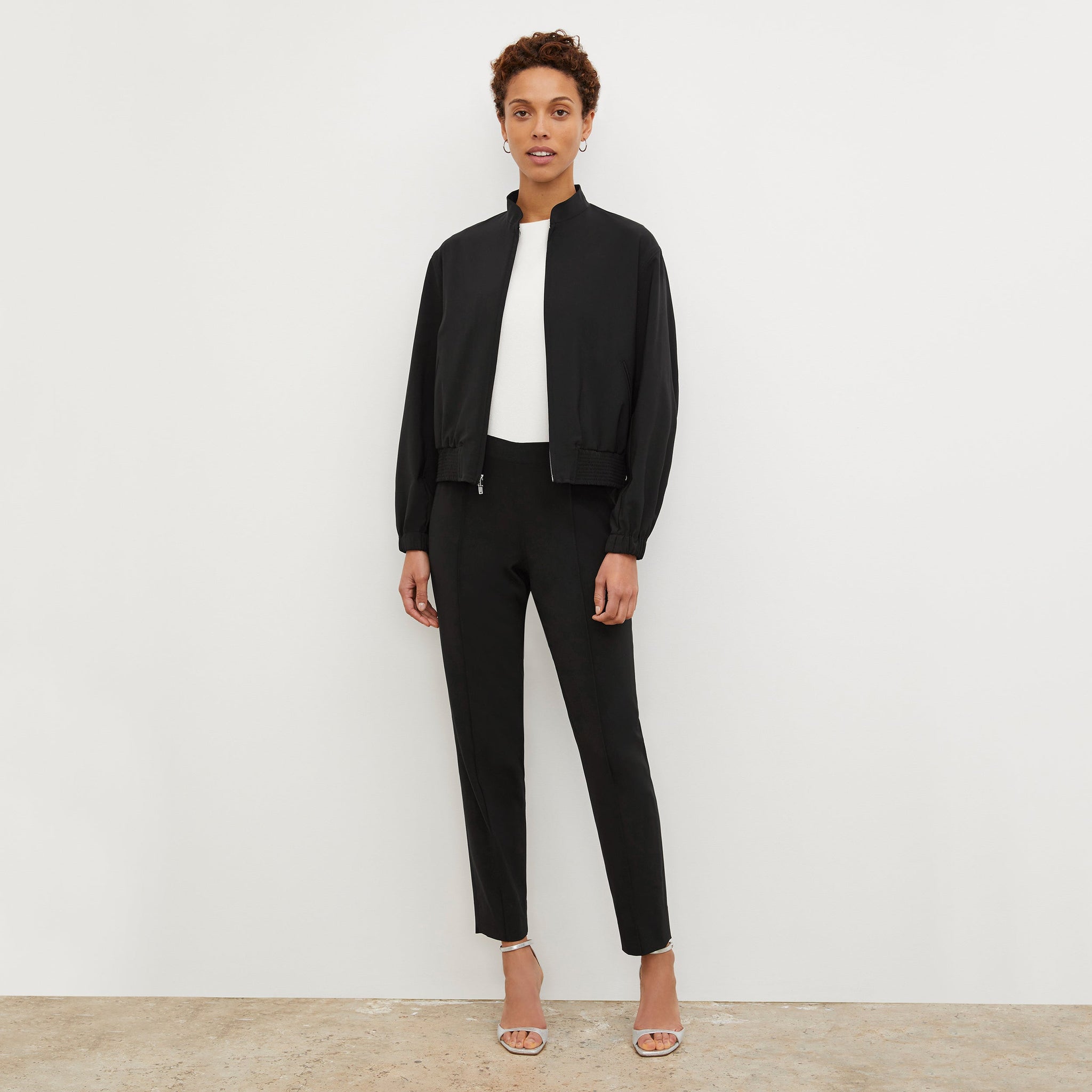 Front image of a woman standing wearing the Colby Jogger in Black