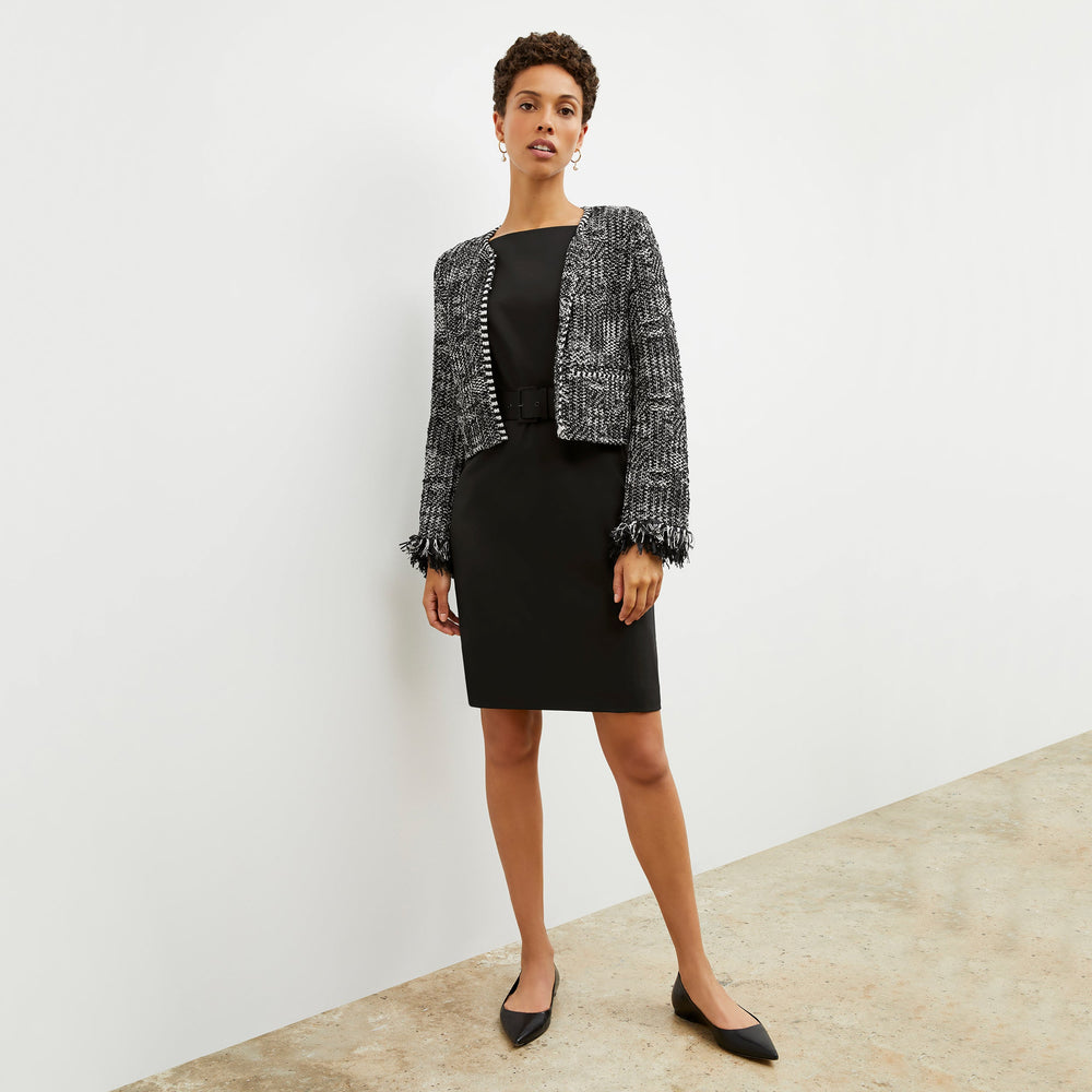 Front image of a woman standing wearing the cynthia dress in black