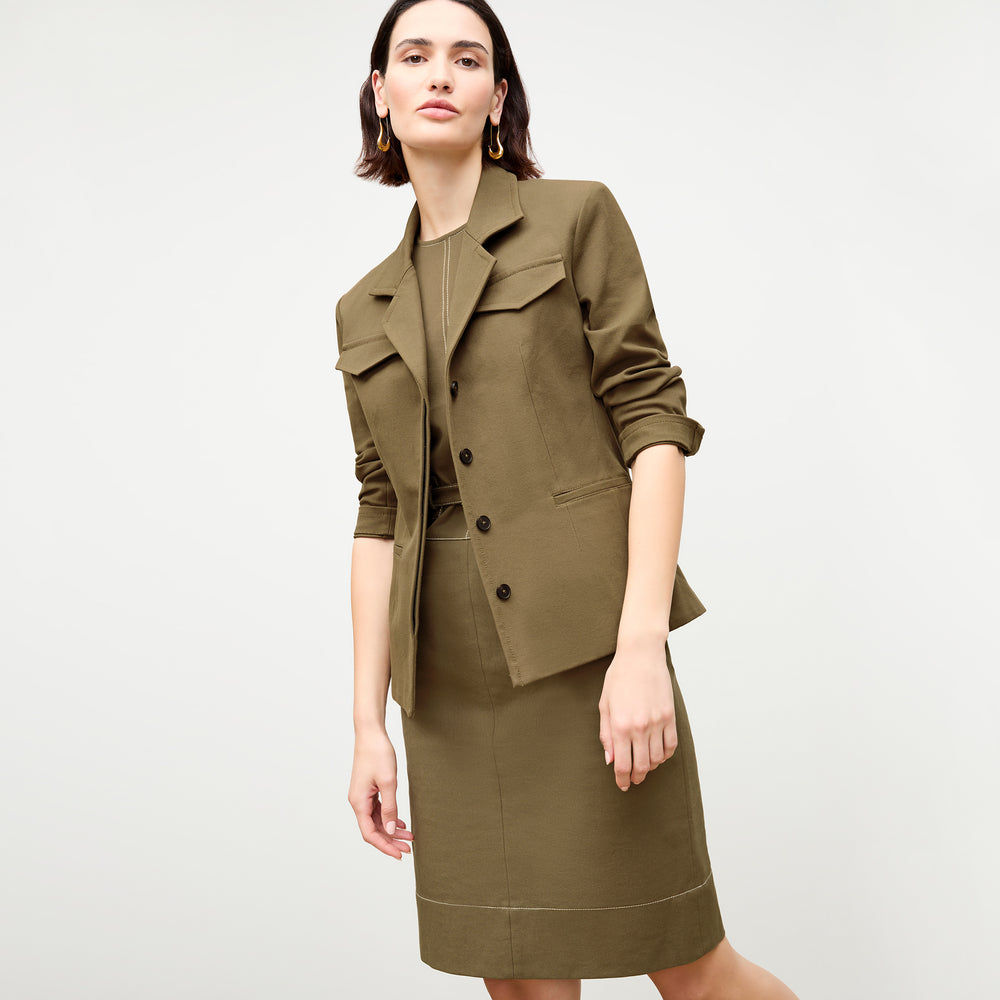 front image of a woman wearing the maude dress in oregano