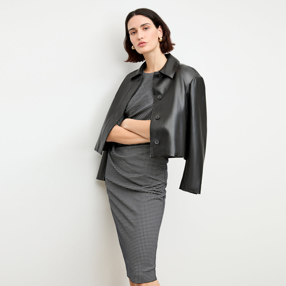 Front image of a woman wearing the nicky jacket in black