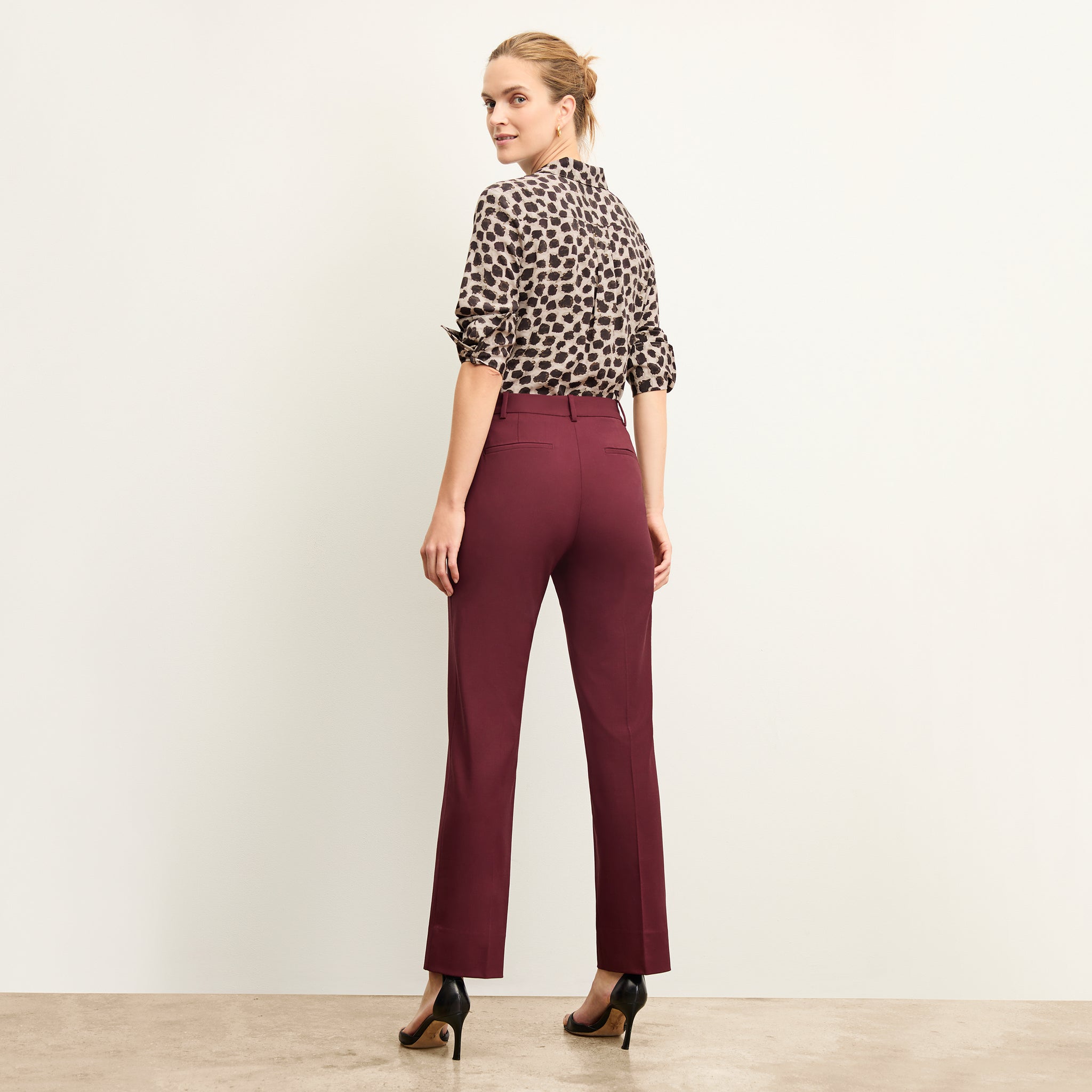 Back image of a woman wearing the tatum shirt in sahara print 