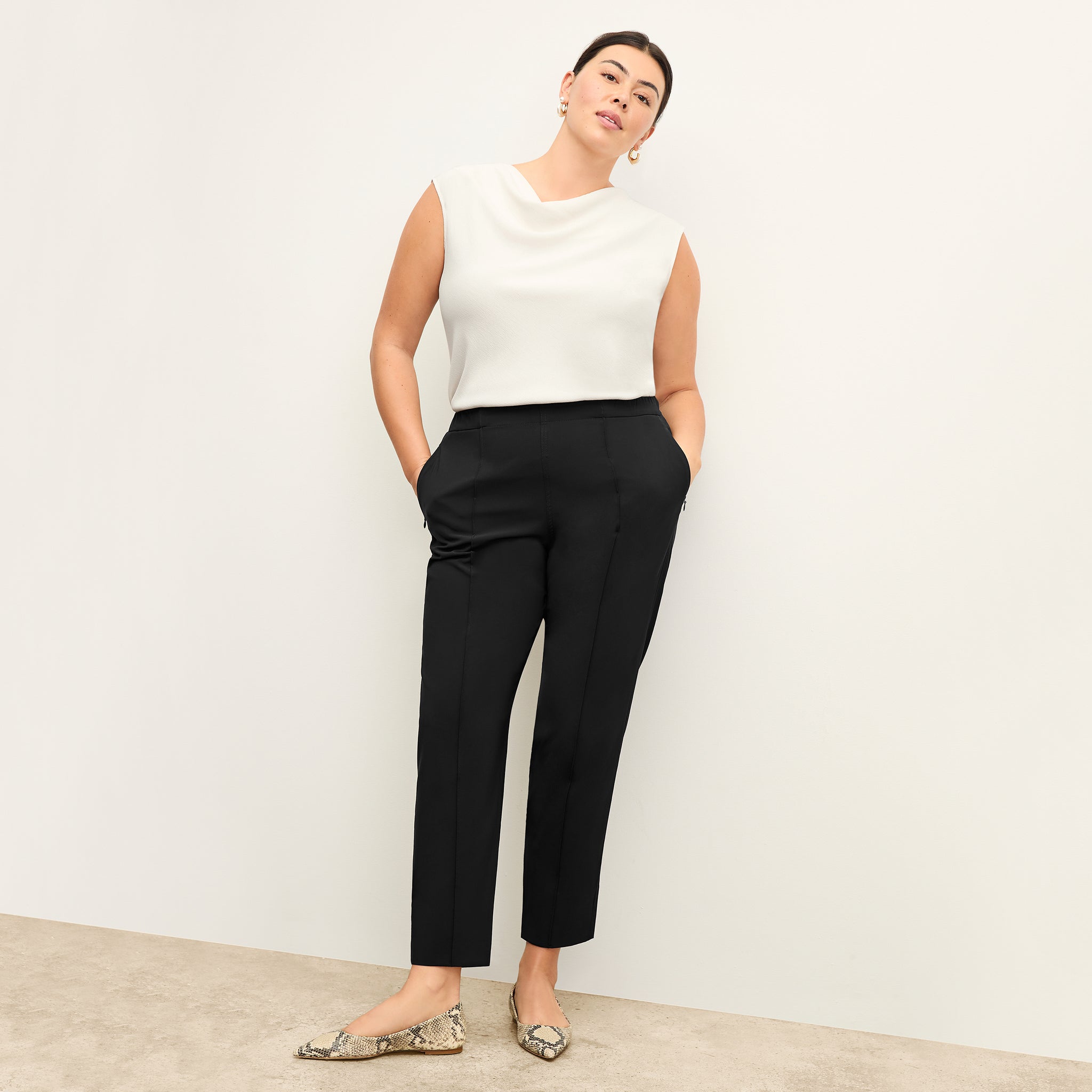 Front image of a woman wearing the Nora Top in Alabaster