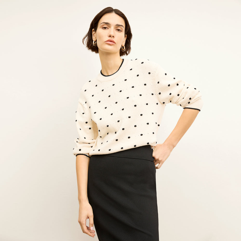 front image of a woman wearing the kim sweater in dot knit