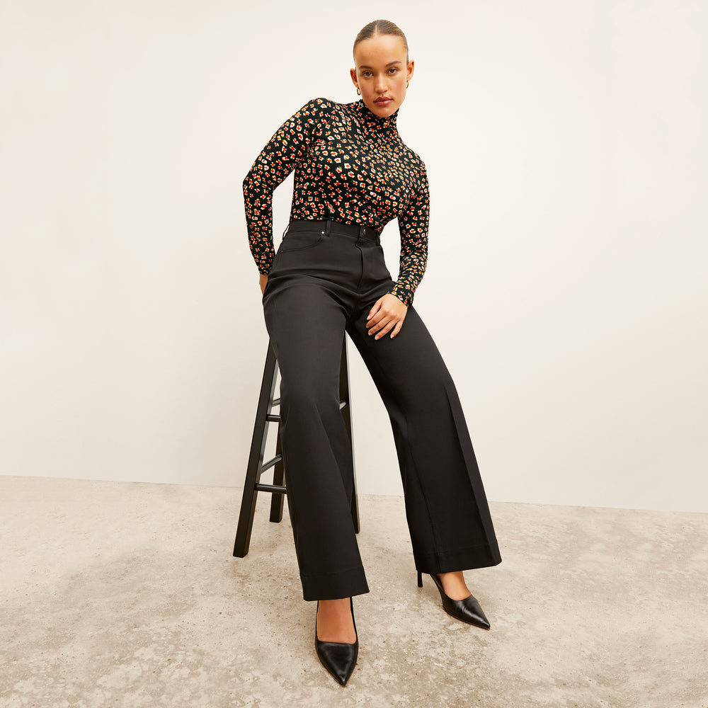 front image of a woman wearing the axam top in kaleidoscope print