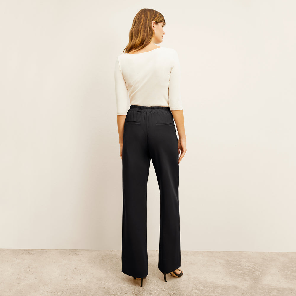 back image of a woman wearing the jordan trouser in black