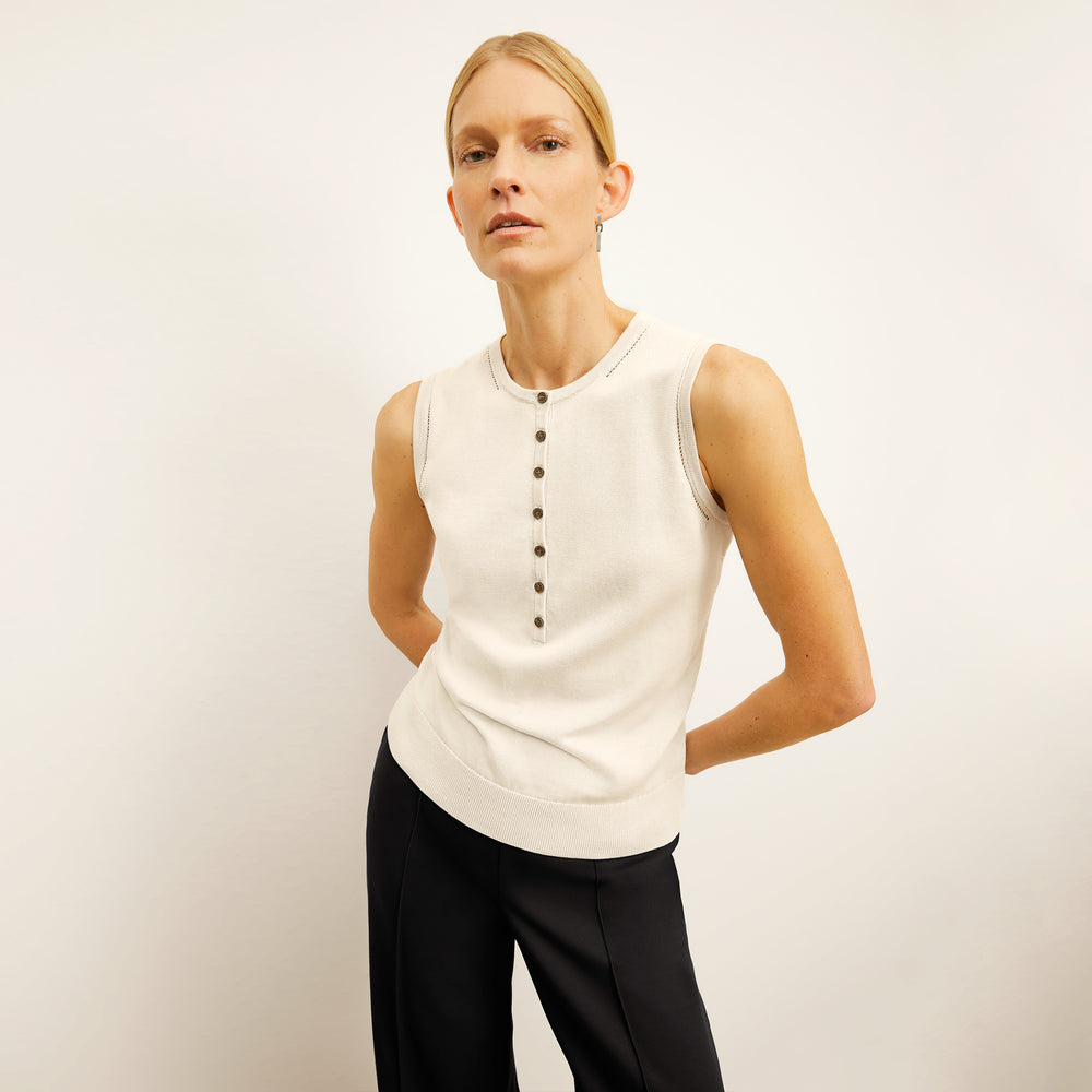 front image of a woman wearing the crimmins top in ivory