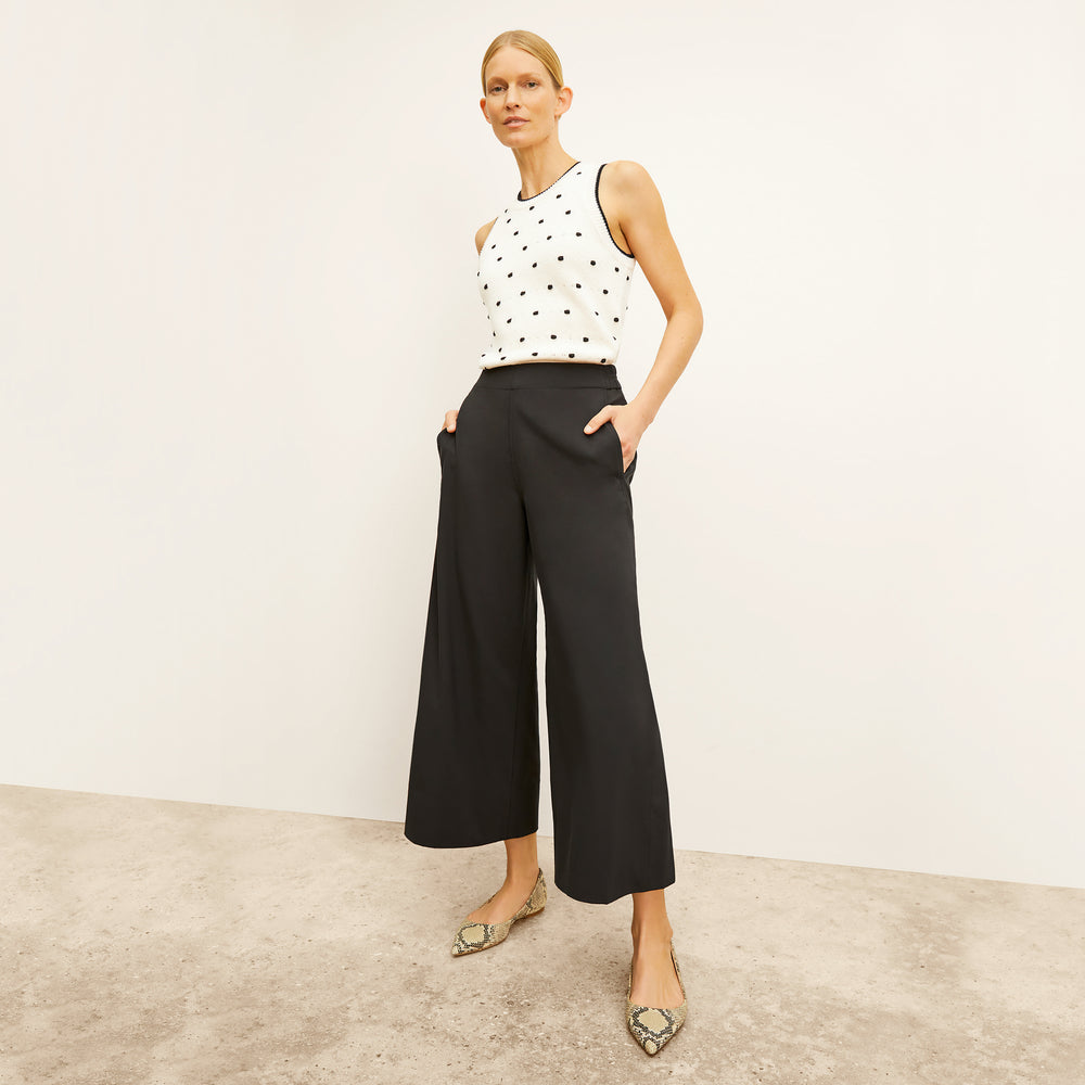 front image of a woman wearing the patty top in dot knit