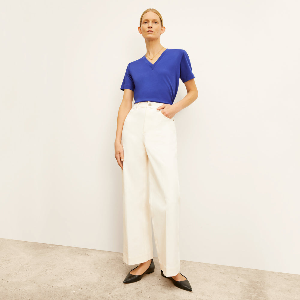 front image of a woman wearing the lee t-shirt in bright indigo