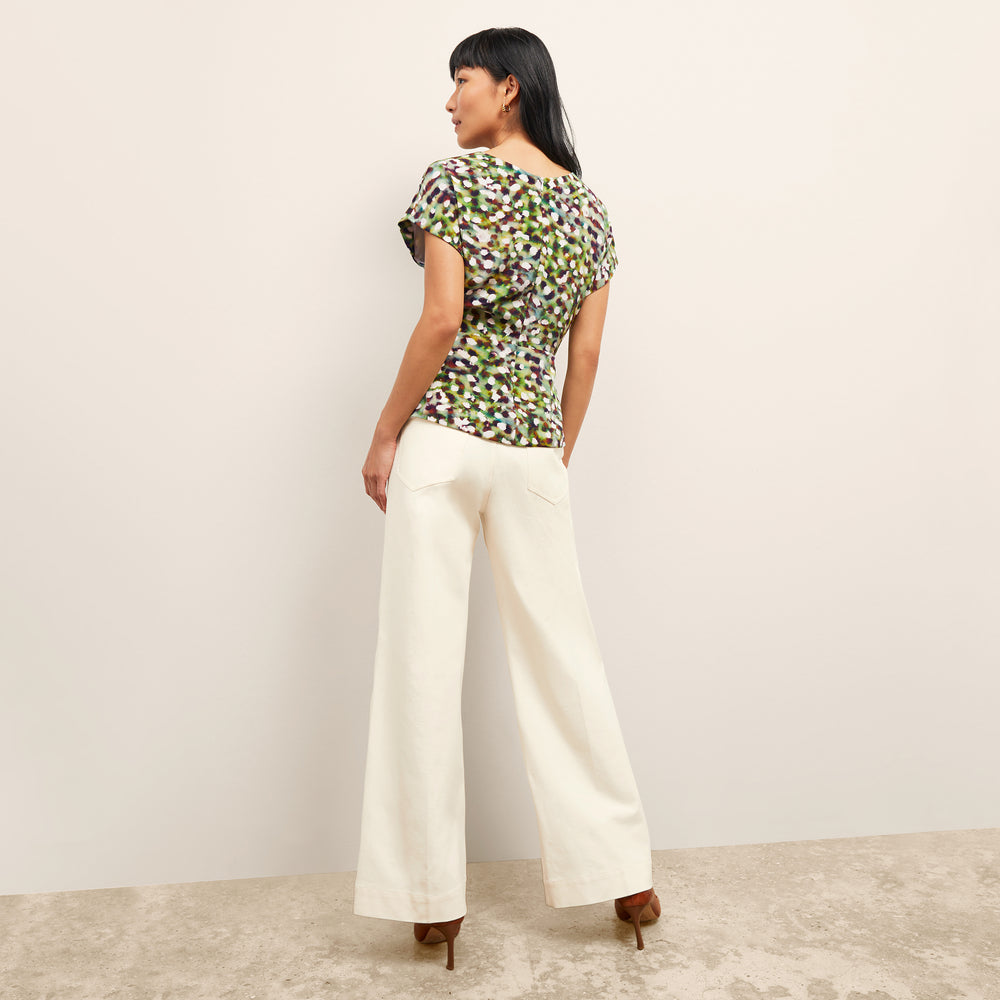 back image of a woman wearing the nejvi top in spotlight print