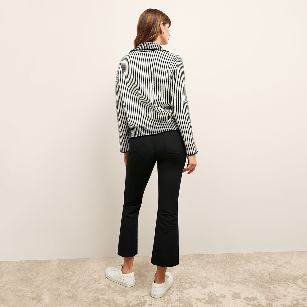 back image of a woman wearing the maja sweater in black/ivory