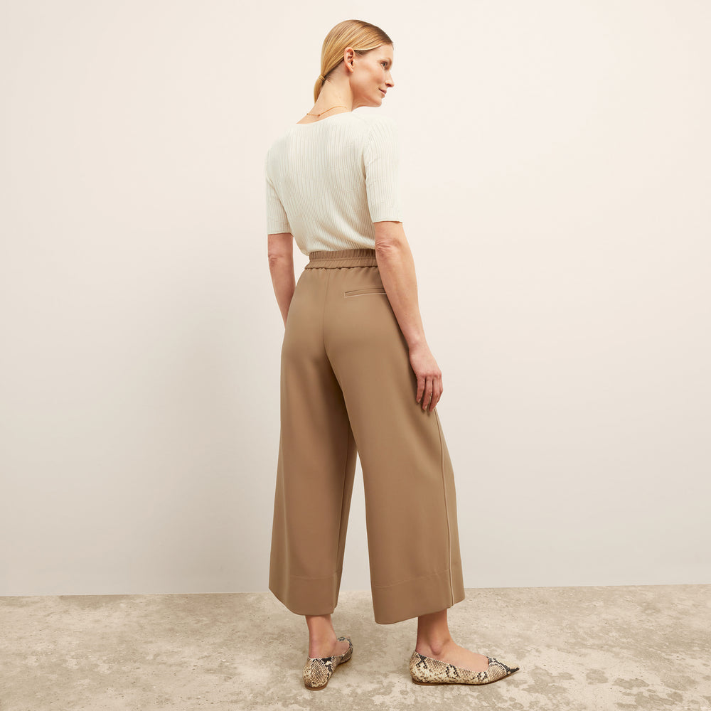 back image of a woman wearing the charlie top in ivory