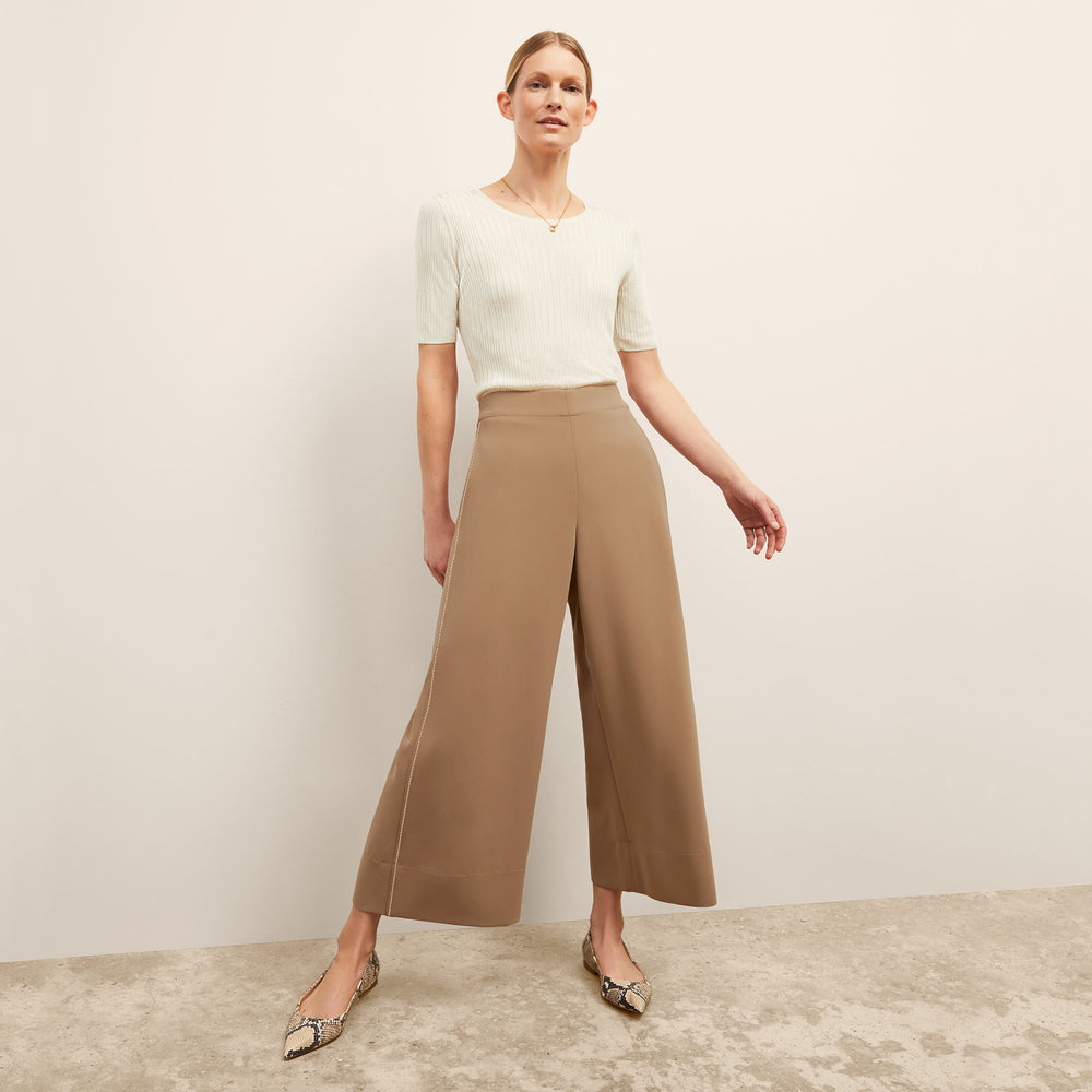front image of a woman wearing the charlie top in ivory