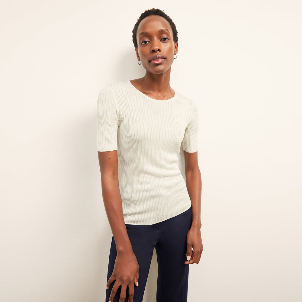front image of a woman wearing the charlie top in ivory